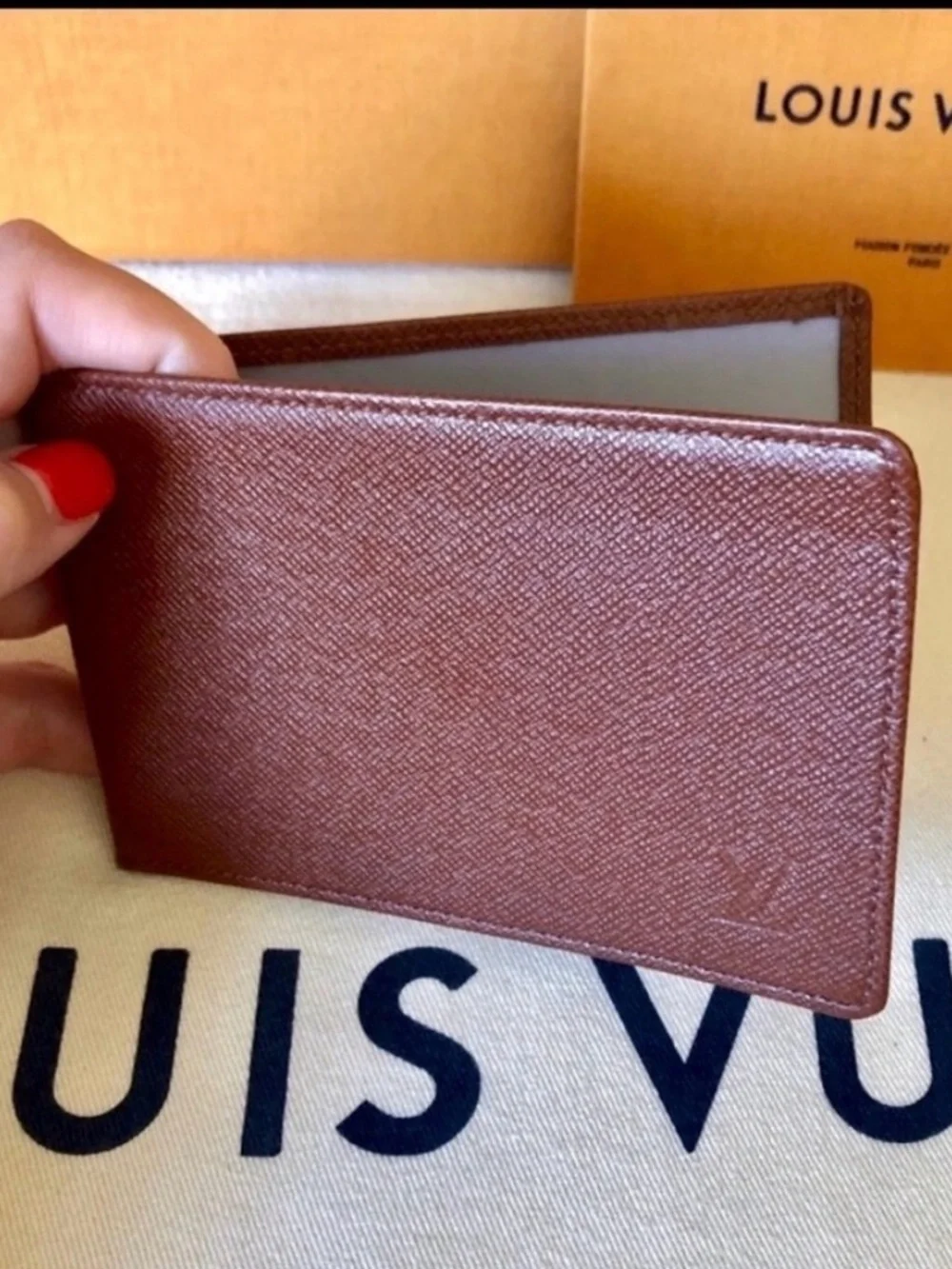 LOUIS VUITTON brown multiple bifold wallet in durable Taiga cross-grain leather